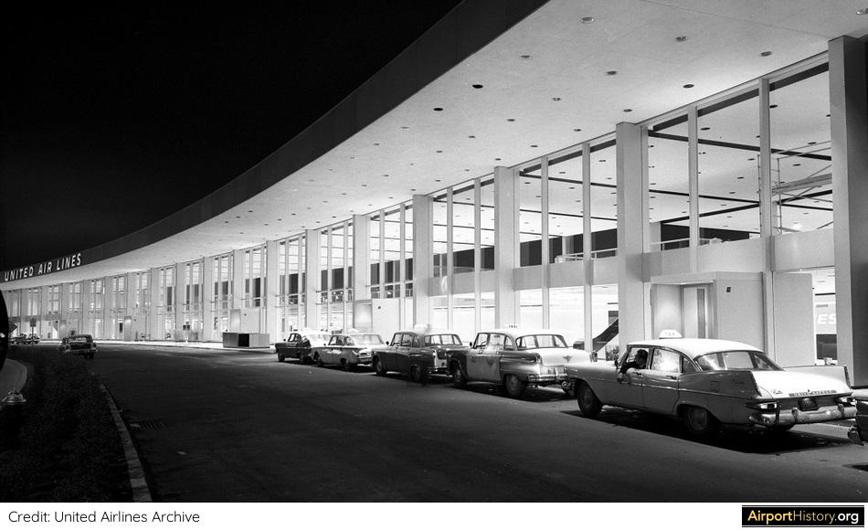 A nighttime exterior view of the United terminal at New York Idlewild Airport